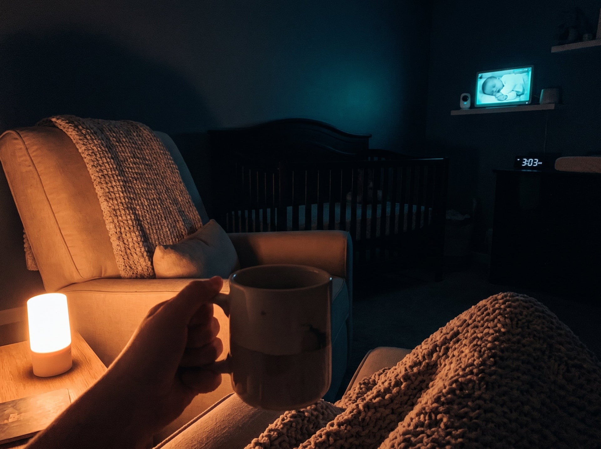 A first-person perspective of a late-night breast milk pumping and feeding routine in a quiet nursery.